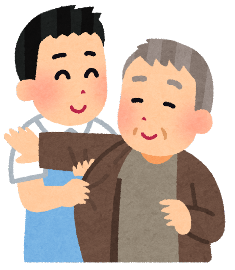 着替えを手伝う介護士